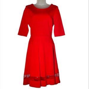 LuLu’s Vibrant MIDI Red Dress with sheer skirt panels. Size M